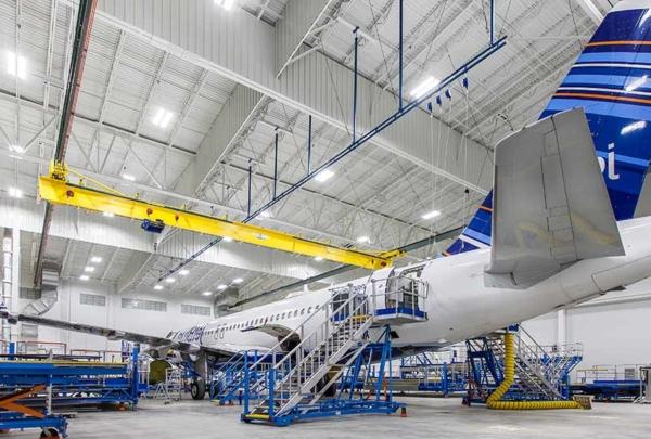 Airplane sitting inside Lufthansa Technik Heavy Maintenance Facility.